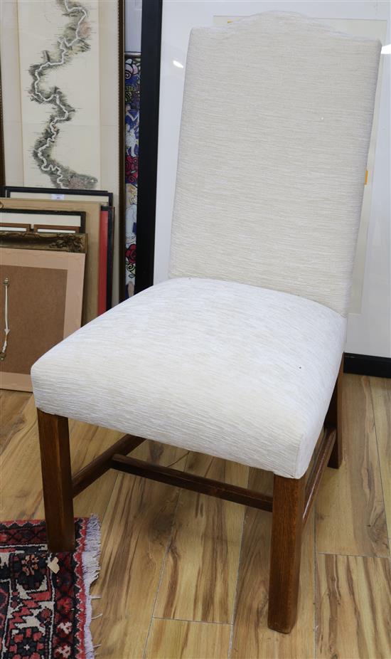 A set of eight upholstered oak dining chairs